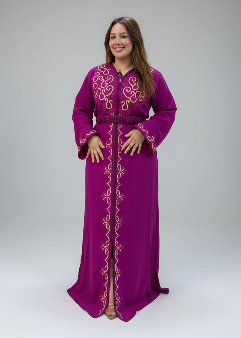 A woman modeling a magenta-purple Moroccan caftan with gold embroidery,