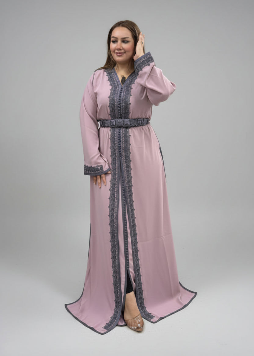 Model wearing a stylish Imperial Modern Caftan featuring intricate lace detailing in pink and gray.