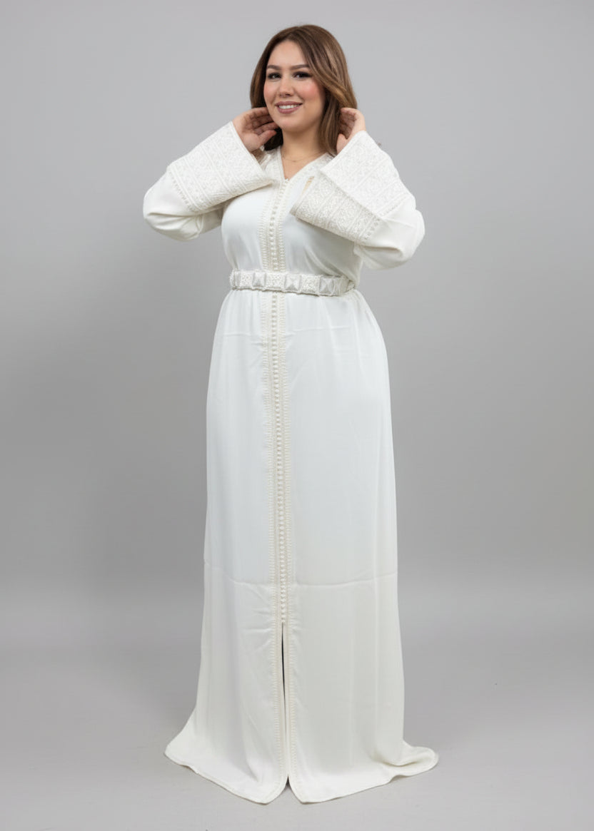 Woman wearing a white dress with gold accents in a clothing store.
"caftan dress"
"women's caftan"
"kaftan"
"cotton caftan"
"caftan moroccan"
"moroccan caftan"
"men's caftan"
"caftan for women"
"white caftan"
"blue caftan"
"what is caftan"
"caftan dresses"
"caftan men"
"silk caftan"
"vintage caftan"
"maxi dress"
"beach caftan"
"caftan maxi dress"
"caftan for men"
"what is a caftan"
"caftan cover up"
"kaftan dress"
"plus size caftan"
"caftan plus size"
"short caftan"
"linen caftan"
"womens caftan"