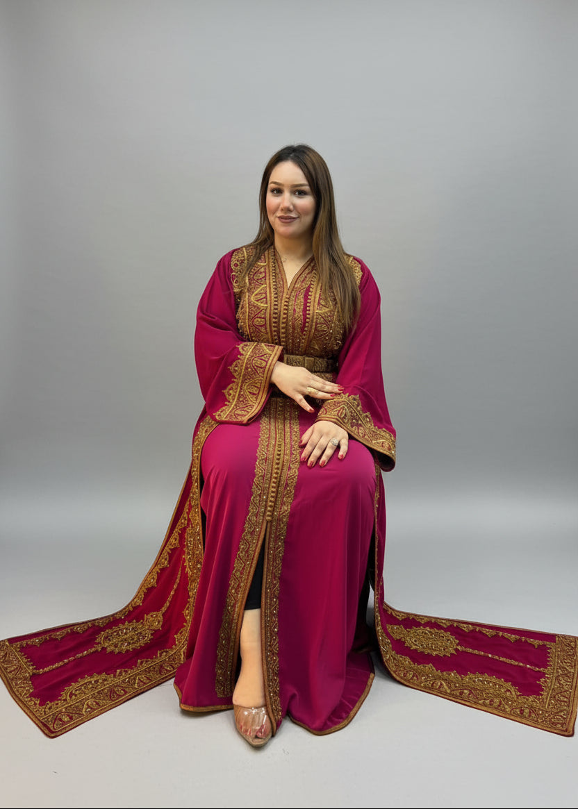 A woman wearing a long Moroccan caftan and gold embroidere