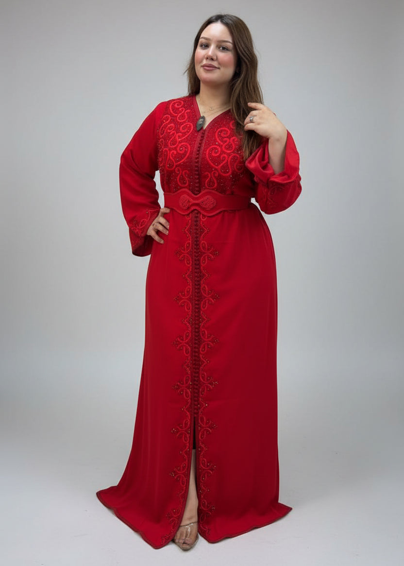 A woman wearing a long red embroidered kaftan