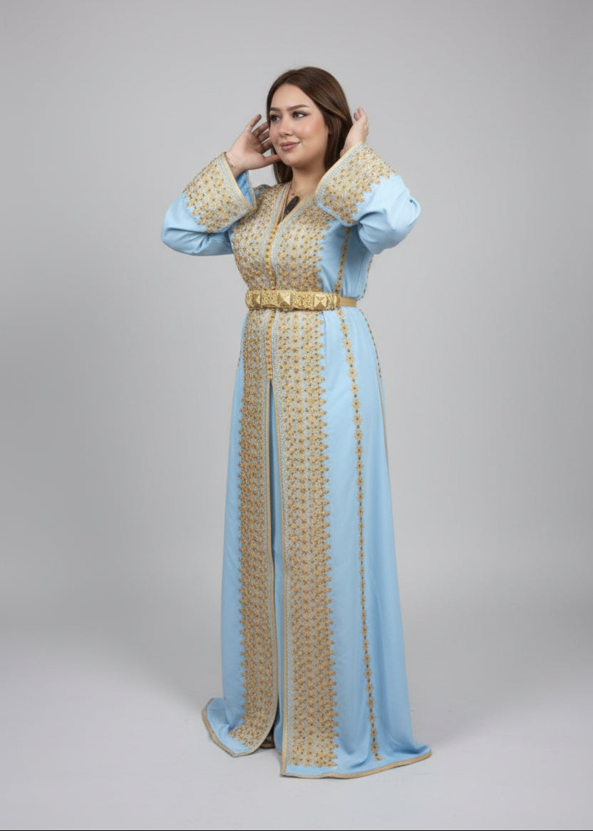 Woman wearing a light blue and gold dress with a plain background "kaftan dress""
"kaftan dresses"
"women kaftan"
"kaftan women"
"black kaftan"
"kaftan for women"
"men's kaftan"
"maxi kaftan"
"kaftan set"
"long kaftan"
"white kaftan"
"kaftan maxi dress"
"cotton kaftan"
"silk kaftan"
"blue kaftan"
"kaftan men"
"men kaftan"
"what is kaftan"
"caftan"
"moroccan kaftan"
"kaftan moroccan"
"kaftan top"
"embroidered kaftan"
"black kaftan dress"
"long kaftan dress"
"linen kaftan"
"abaya"
"kaftan abaya"
