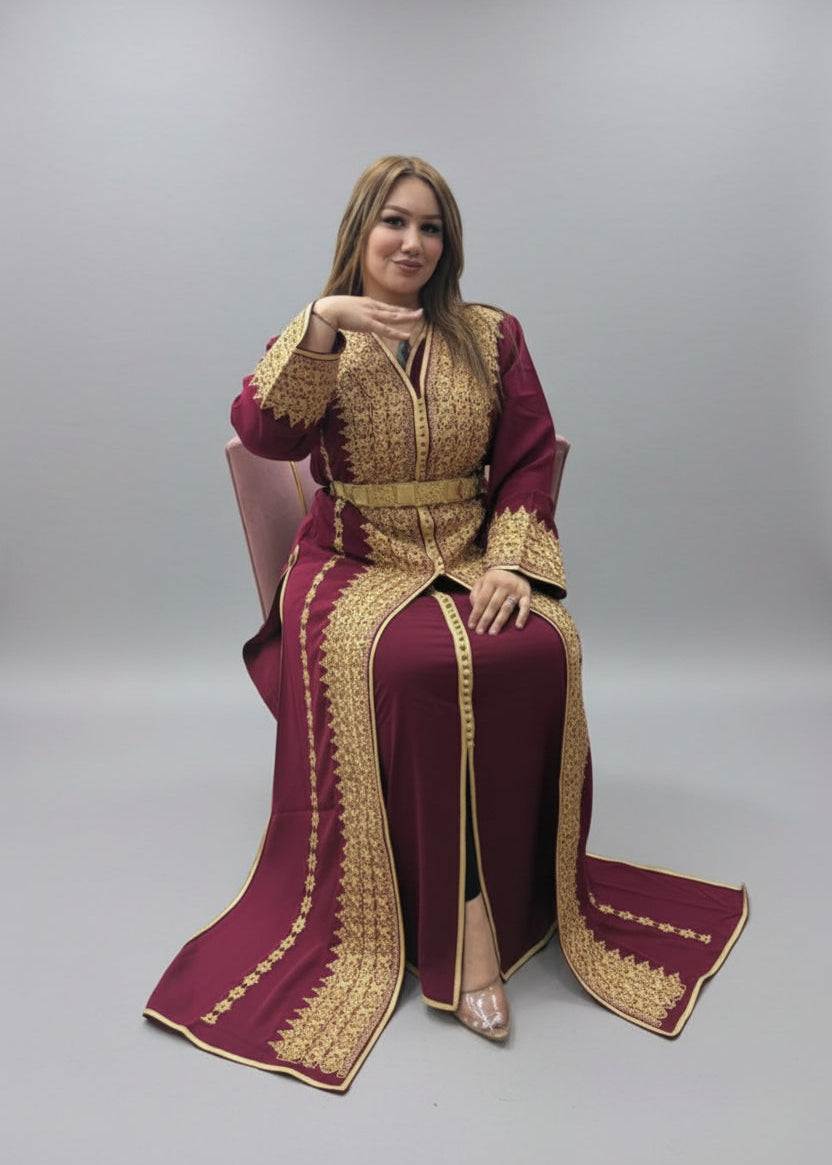 Woman wearing a maroon and gold traditional outfit on a gray background"kaftan dress""
"kaftan dresses"
"women kaftan"
"kaftan women"
"black kaftan"
"kaftan for women"
"men's kaftan"
"maxi kaftan"
"kaftan set"
"long kaftan"
"white kaftan"
"kaftan maxi dress"
"cotton kaftan"
"silk kaftan"
"blue kaftan"
"kaftan men"
"men kaftan"
"what is kaftan"
"caftan"
"moroccan kaftan"
"kaftan moroccan"
"kaftan top"
"embroidered kaftan"
"black kaftan dress"
"long kaftan dress"
"linen kaftan"
"abaya",11,"20%"
"kaftan abaya"