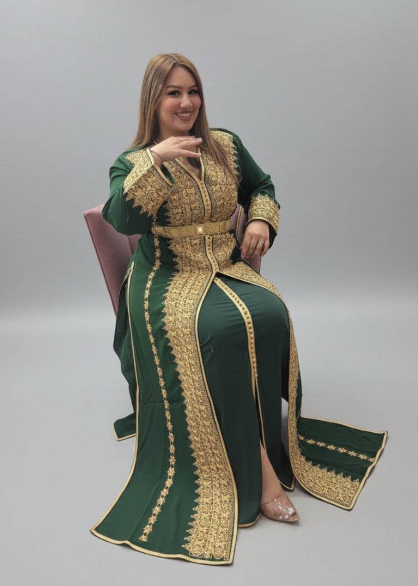 Woman wearing a green and gold traditional outfit in a store setting."kaftan dress""
"kaftan dresses"
"women kaftan"
"kaftan women"
"black kaftan"
"kaftan for women"
"men's kaftan"
"maxi kaftan"
"kaftan set"
"long kaftan"
"white kaftan"
"kaftan maxi dress"
"cotton kaftan"
"silk kaftan"
"blue kaftan"
"kaftan men"
"men kaftan"
"what is kaftan"
"caftan"
"moroccan kaftan"
"kaftan moroccan"
"kaftan top"
"embroidered kaftan"
"black kaftan dress"
"long kaftan dress"
"linen kaftan"
"abaya"
"kaftan abaya"