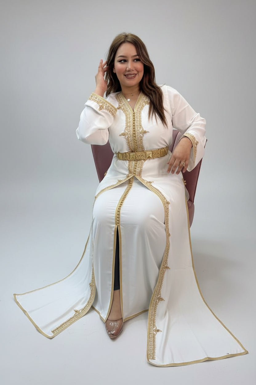 Woman in a white dress with gold accents in a store setting"caftan dress"
"women's caftan"
"kaftan"
"cotton caftan"
"caftan moroccan"
"moroccan caftan"
"men's caftan"
"caftan for women"
"white caftan"
"blue caftan"
"what is caftan"
"caftan dresses"
"caftan men"
"silk caftan"
"vintage caftan"
"maxi dress"
"beach caftan"
"caftan maxi dress"
"caftan for men"
"what is a caftan"
"caftan cover up"
"kaftan dress"
"plus size caftan"
"caftan plus size"
"short caftan"
"linen caftan"
"womens caftan"
"caftan meaning"
"