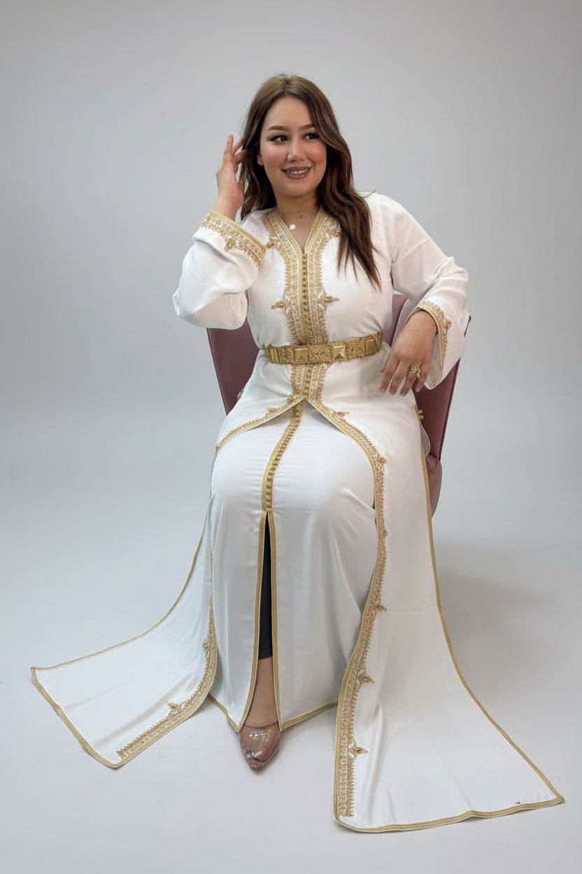 Woman in a white dress with gold accents in a store setting"caftan dress"
"women's caftan"
"kaftan"
"cotton caftan"
"caftan moroccan"
"moroccan caftan"
"men's caftan"
"caftan for women"
"white caftan"
"blue caftan"
"what is caftan"
"caftan dresses"
"caftan men"
"silk caftan"
"vintage caftan"
"maxi dress"
"beach caftan"
"caftan maxi dress"
"caftan for men"
"what is a caftan"
"caftan cover up"
"kaftan dress"
"plus size caftan"
"caftan plus size"
"short caftan"
"linen caftan"
"womens caftan"
"caftan meaning"
"