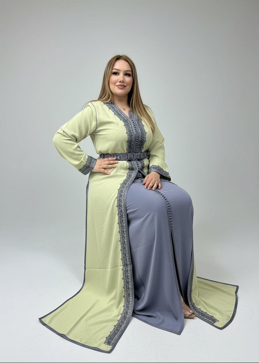 Woman trying on a green and gray traditional outfit in a store.
"caftan dress"
"women's caftan"
"kaftan"
"cotton caftan"
"caftan moroccan"
"moroccan caftan"
"men's caftan"
"caftan for women"
"white caftan"
"blue caftan"
"what is caftan"
"caftan dresses"
"caftan men"
"silk caftan"
"vintage caftan"
"maxi dress"
"beach caftan"
"caftan maxi dress"
"caftan for men"
"what is a caftan"
"caftan cover up"
"kaftan dress"
"plus size caftan"
"caftan plus size"
"short caftan"
"linen caftan"
"womens caftan"