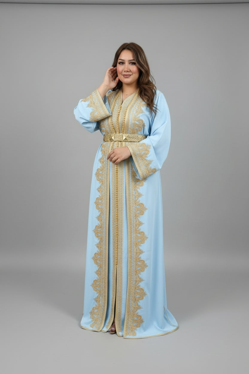 Woman wearing a light blue dress with gold embroidery in a fabric store."caftan dress"
"women's caftan"
"kaftan"
"cotton caftan"
"caftan moroccan"
"moroccan caftan"
"caftan for women"
"white caftan"
"blue caftan"
"what is caftan"
"caftan dresses"
"silk caftan"
"vintage caftan"
"maxi dress"
"beach caftan"
"caftan maxi dress"
"caftan for men"
"what is a caftan"
"caftan cover up"
"kaftan dress"
"plus size caftan"
"caftan plus size"
"short caftan"
"linen caftan"
"womens caftan"
"caftan meaning"
"caftan pattern"