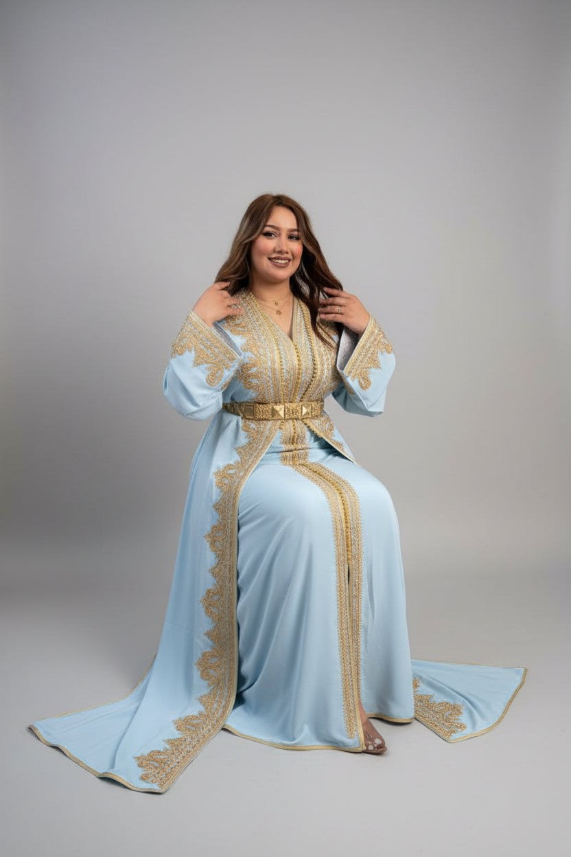 Woman wearing a light blue dress with gold embroidery in a store "caftan dress"
"women's caftan"
"kaftan"
"cotton caftan"
"caftan moroccan"
"moroccan caftan"
"caftan for women"
"white caftan"
"blue caftan"
"what is caftan"
"caftan dresses"
"silk caftan"
"vintage caftan"
"maxi dress"
"beach caftan"
"caftan maxi dress"
"caftan for men"
"what is a caftan"
"caftan cover up"
"kaftan dress"
"plus size caftan"
"caftan plus size"
"short caftan"
"linen caftan"
"womens caftan"
"caftan meaning"