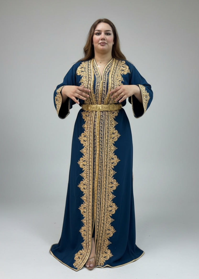 Woman wearing a blue and gold embroidered dress in a clothing store.
"caftan dress"
"women's caftan"
"kaftan"
"cotton caftan"
"caftan moroccan"
"moroccan caftan"
"men's caftan"
"caftan for women"
"white caftan"
"blue caftan"
"what is caftan"
"caftan dresses"
"silk caftan"
"vintage caftan"
"maxi dress"
"beach caftan"
"caftan maxi dress"
"caftan for men"
"what is a caftan"
"caftan cover up"
"kaftan dress"
"plus size caftan"
"caftan plus size"
"short caftan"
"linen caftan"
"womens caftan"
"caftan meaning"