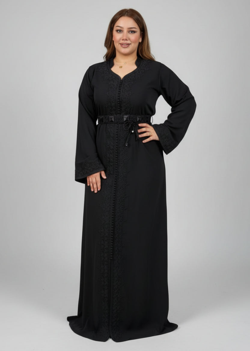 Woman in a black outfit standing in a clothing store with colorful fabrics in the background.
"kaftan dress""
"kaftan dresses"
"women kaftan"
"kaftan women"
"black kaftan"
"kaftan for women"
"men's kaftan"
"maxi kaftan"
"kaftan set"
"long kaftan"
"white kaftan"
"kaftan maxi dress"
"cotton kaftan"
"silk kaftan"
"blue kaftan"
"kaftan men"
"men kaftan"
"what is kaftan"
"caftan"
"moroccan kaftan"
"kaftan moroccan"
"kaftan top"
"embroidered kaftan"
"black kaftan dress"
"long kaftan dress"
"linen kaftan"
"abaya"