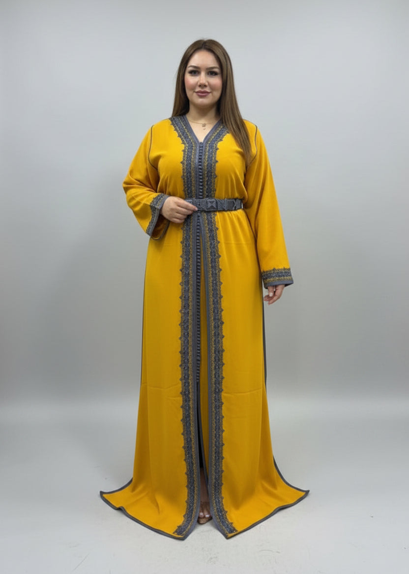 Woman wearing a yellow dress with intricate patterns in a fabric store.
"caftan dress"
"women's caftan"
"kaftan"
"cotton caftan"
"caftan moroccan"