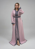 Model wearing a stylish Imperial Modern Caftan featuring intricate lace detailing in pink and gray.