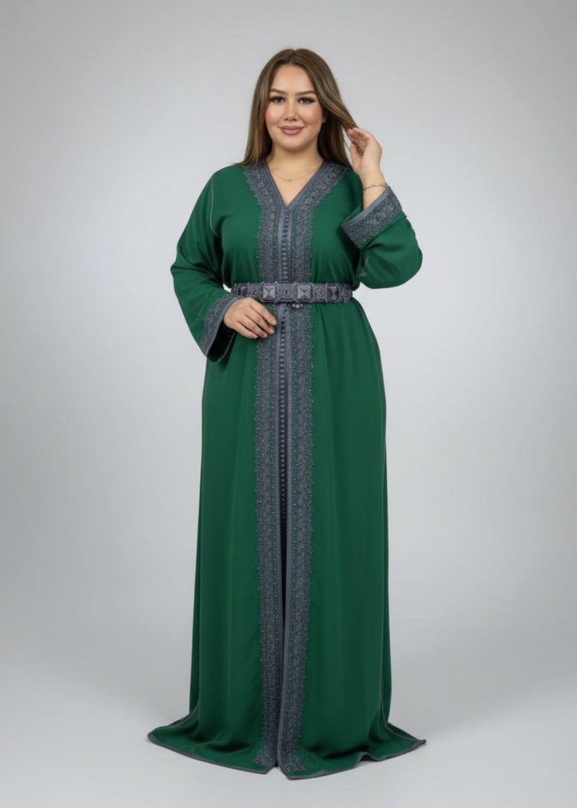 Woman wearing a green and gray dress in a clothing store.
"caftan dress"
"women's caftan"
"kaftan"
