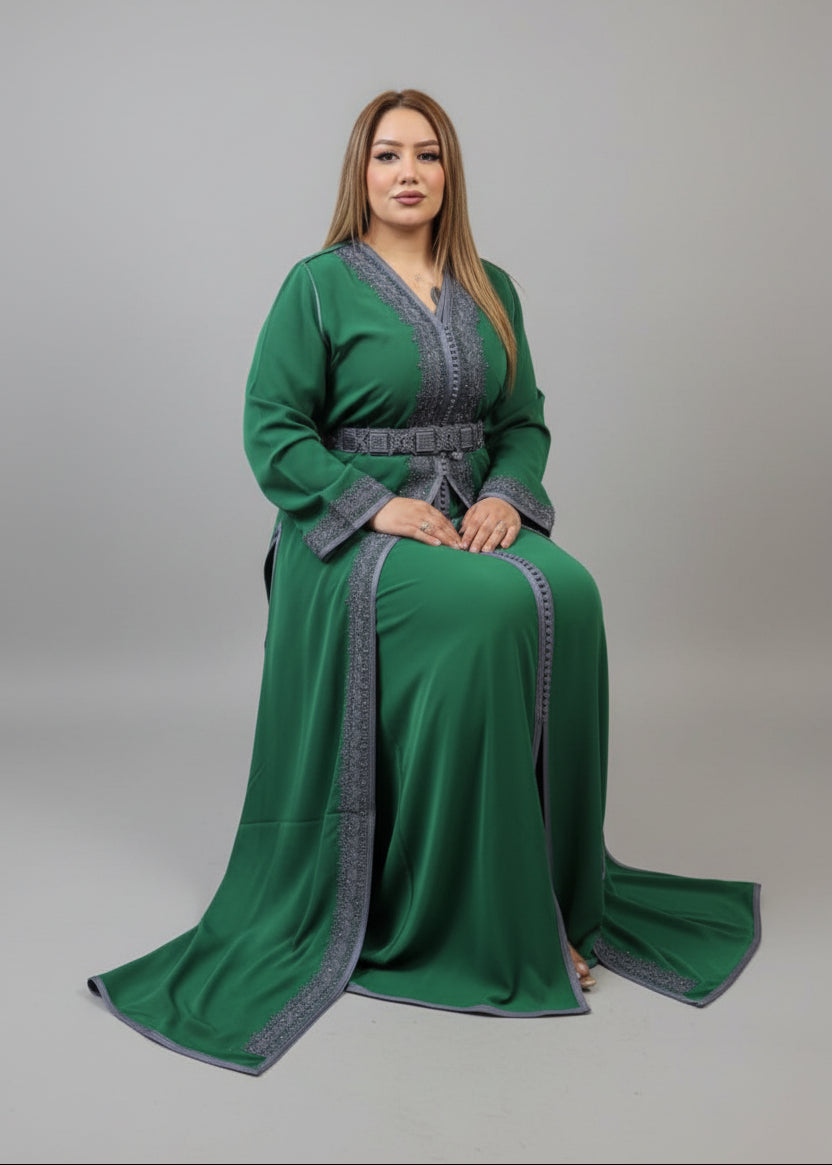 Woman in a green dress with silver trim standing in a store.
"caftan dress"
"women's caftan"
"kaftan"