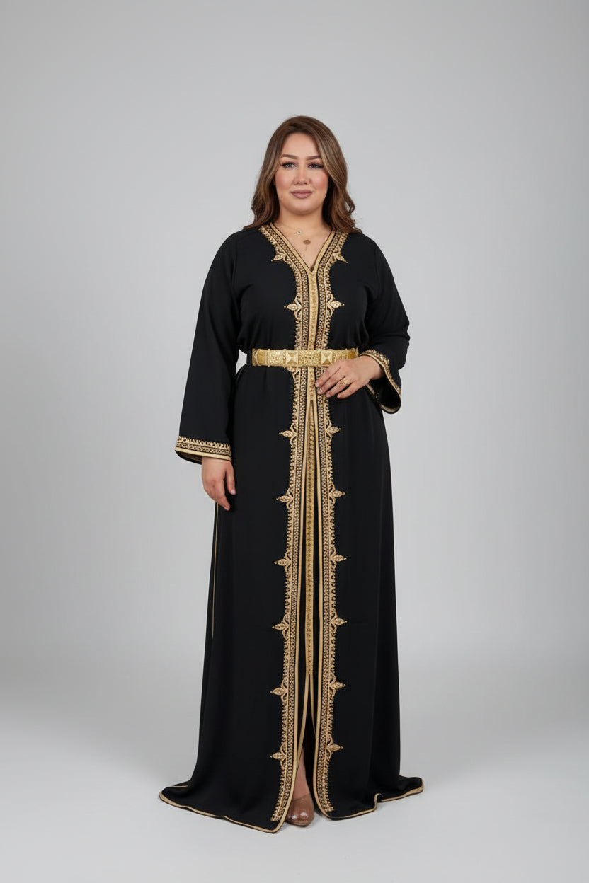 Woman in a black dress with gold embroidery standing in a clothing "caftan dress"
"women's caftan"
"kaftan"
"cotton caftan"
"caftan moroccan"
"moroccan caftan"
"men's caftan"
"caftan for women"
"white caftan"
"blue caftan"
"what is caftan"
"caftan dresses"
"caftan men"
"silk caftan"
"vintage caftan"
"maxi dress"
"beach caftan"
"caftan maxi dress"
"caftan for men"
"what is a caftan"
"caftan cover up"
"kaftan dress"
"plus size caftan"
"caftan plus size"
"short caftan"
"linen caftan"
"womens caftan"
