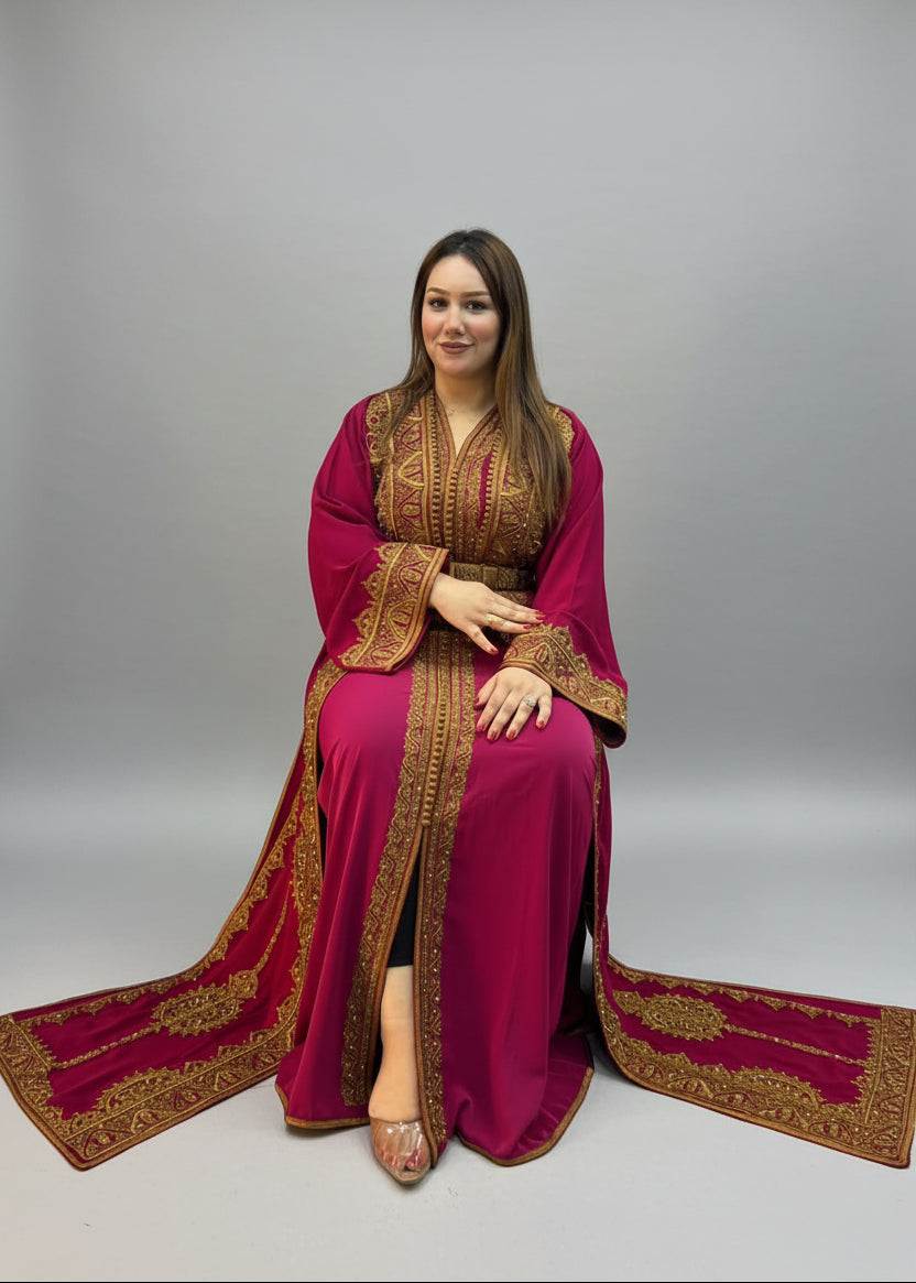 A woman wearing a long Moroccan caftan and gold embroidere