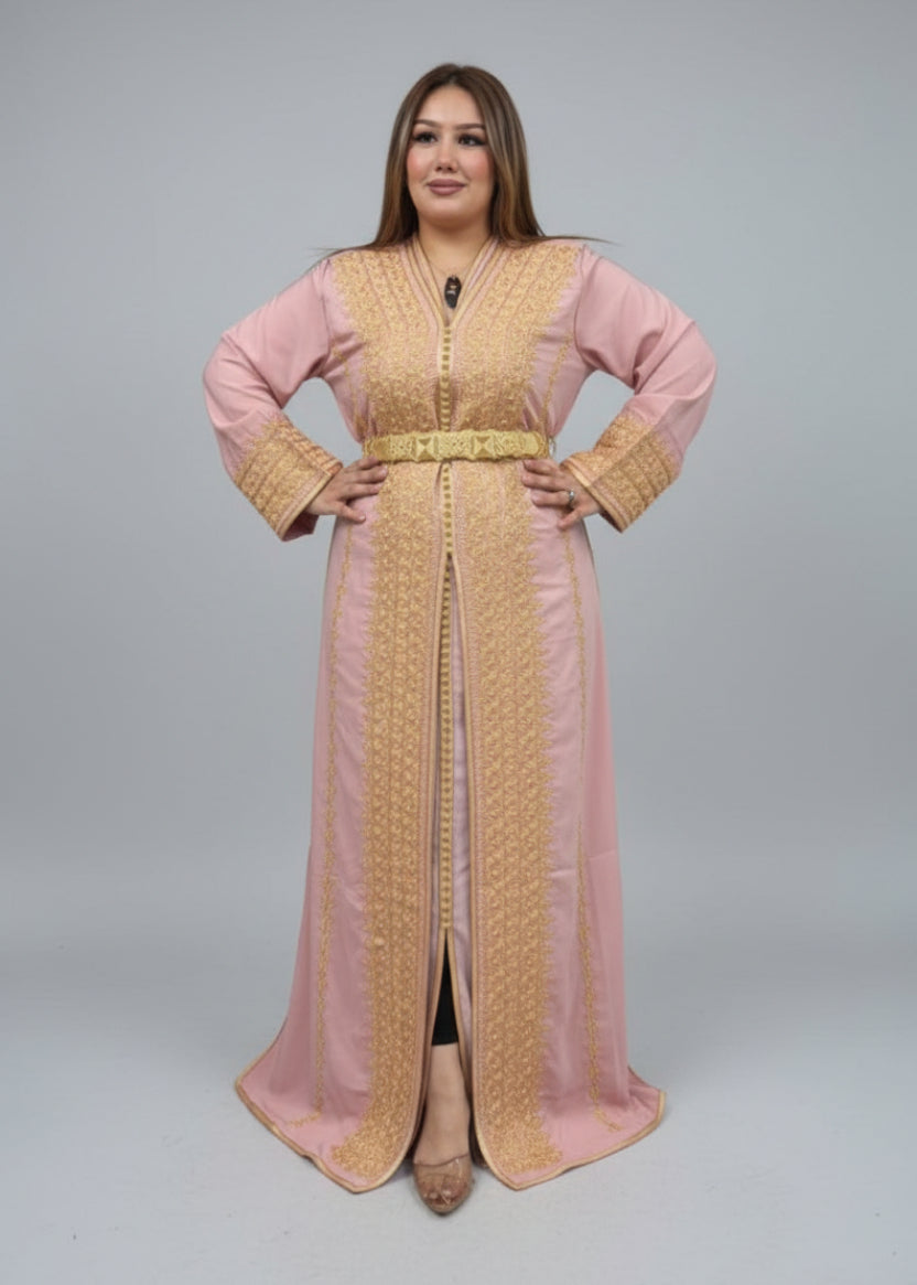 Woman wearing a traditional outfit in a clothing store with shelves of fabric in the background."kaftan dress""
"kaftan dresses"
"women kaftan"
"kaftan women"
"black kaftan"
"kaftan for women"
"men's kaftan"
"maxi kaftan"
"kaftan set"
"long kaftan"
"white kaftan"
"kaftan maxi dress"
"cotton kaftan"
"silk kaftan"
"blue kaftan"
"kaftan men"
"men kaftan"
"what is kaftan"
"caftan"
"moroccan kaftan"
"kaftan moroccan"
"kaftan top"
"embroidered kaftan"
"black kaftan dress"
"long kaftan dress"
"linen kaftan"
