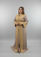 Woman wearing a gold and beige dress in a clothing store."kaftan dress""
"kaftan dresses"
"women kaftan"
"kaftan women"
"black kaftan"
"kaftan for women"
"men's kaftan"
"maxi kaftan"
"kaftan set"
"long kaftan"
"white kaftan"
"kaftan maxi dress"
"cotton kaftan"
"silk kaftan"
"blue kaftan"
"kaftan men"
"men kaftan"
"what is kaftan"
"caftan"
"moroccan kaftan"
"kaftan moroccan"
"kaftan top"
"embroidered kaftan"
"black kaftan dress"
"long kaftan dress"
"linen kaftan"
"abaya"
"kaftan abaya"
