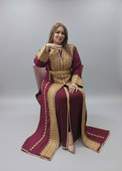 Woman wearing a maroon and gold traditional outfit on a gray background"kaftan dress""
"kaftan dresses"
"women kaftan"
"kaftan women"
"black kaftan"
"kaftan for women"
"men's kaftan"
"maxi kaftan"
"kaftan set"
"long kaftan"
"white kaftan"
"kaftan maxi dress"
"cotton kaftan"
"silk kaftan"
"blue kaftan"
"kaftan men"
"men kaftan"
"what is kaftan"
"caftan"
"moroccan kaftan"
"kaftan moroccan"
"kaftan top"
"embroidered kaftan"
"black kaftan dress"
"long kaftan dress"
"linen kaftan"
"abaya",11,"20%"
"kaftan abaya"