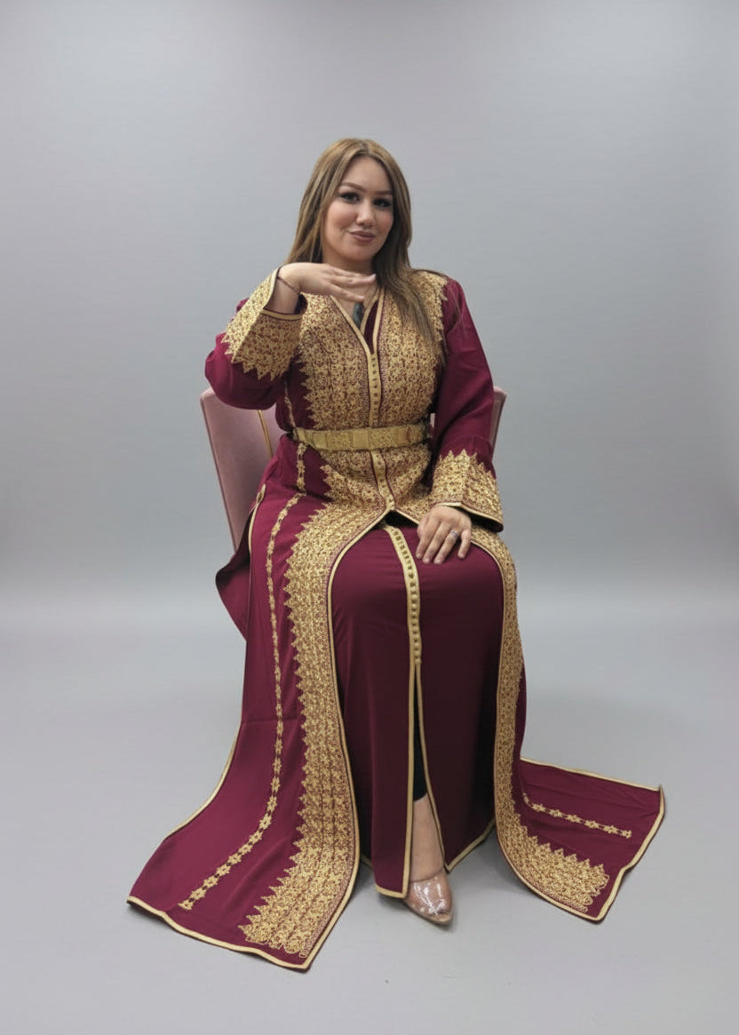 Woman wearing a maroon and gold traditional outfit on a gray background"kaftan dress""
"kaftan dresses"
"women kaftan"
"kaftan women"
"black kaftan"
"kaftan for women"
"men's kaftan"
"maxi kaftan"
"kaftan set"
"long kaftan"
"white kaftan"
"kaftan maxi dress"
"cotton kaftan"
"silk kaftan"
"blue kaftan"
"kaftan men"
"men kaftan"
"what is kaftan"
"caftan"
"moroccan kaftan"
"kaftan moroccan"
"kaftan top"
"embroidered kaftan"
"black kaftan dress"
"long kaftan dress"
"linen kaftan"
"abaya",11,"20%"
"kaftan abaya"