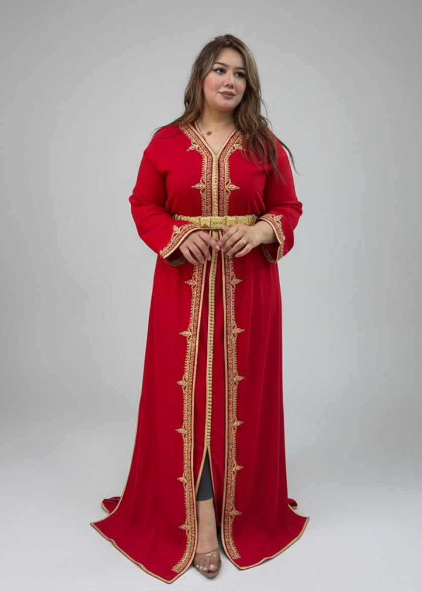Woman in a red dress with gold embroidery standing in a clothing "caftan dress"
"women's caftan"
"kaftan"
"cotton caftan"
"caftan moroccan"
"moroccan caftan"
"men's caftan"
"caftan for women"
"white caftan"
"blue caftan"
"what is caftan"
"caftan dresses"
"caftan men"
"silk caftan"
"vintage caftan"
"maxi dress"
"beach caftan"
"caftan maxi dress"
"caftan for men"
"what is a caftan"
"caftan cover up"
"kaftan dress"
"plus size caftan"
"caftan plus size"
"short caftan"
"linen caftan"
"womens caftan"
