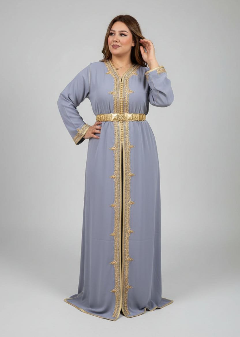 Woman in a gray dress with gold accents standing in a store with clothing racks and shelves."caftan dress"
"women's caftan"
"kaftan"
"cotton caftan"
"caftan moroccan"
"moroccan caftan"
"men's caftan"
"caftan for women"
"white caftan"
"blue caftan"
"what is caftan"
"caftan dresses"
"caftan men"
"silk caftan"
"vintage caftan"
"maxi dress"
"beach caftan"
"caftan maxi dress"
"caftan for men"
"what is a caftan"
"caftan cover up"
"kaftan dress"
"plus size caftan"
"caftan plus size"
"short caftan"
"linen caftan"