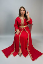 Woman in a red traditional outfit with gold accents in a store setting."caftan dress"
"women's caftan"
"kaftan"
"cotton caftan"
"caftan moroccan"
"moroccan caftan"
"men's caftan"
"caftan for women"
"white caftan"
"blue caftan"
"what is caftan"
"caftan dresses"
"caftan men"
"silk caftan"
"vintage caftan"
"maxi dress"
"beach caftan"
"caftan maxi dress"
"caftan for men"
"what is a caftan"
"caftan cover up"
"kaftan dress"
"plus size caftan"
"caftan plus size"
"short caftan"
"linen caftan"
"womens caftan"