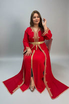 Woman in a red traditional outfit with gold accents in a store setting."caftan dress"
"women's caftan"
"kaftan"
"cotton caftan"
"caftan moroccan"
"moroccan caftan"
"men's caftan"
"caftan for women"
"white caftan"
"blue caftan"
"what is caftan"
"caftan dresses"
"caftan men"
"silk caftan"
"vintage caftan"
"maxi dress"
"beach caftan"
"caftan maxi dress"
"caftan for men"
"what is a caftan"
"caftan cover up"
"kaftan dress"
"plus size caftan"
"caftan plus size"
"short caftan"
"linen caftan"
"womens caftan"