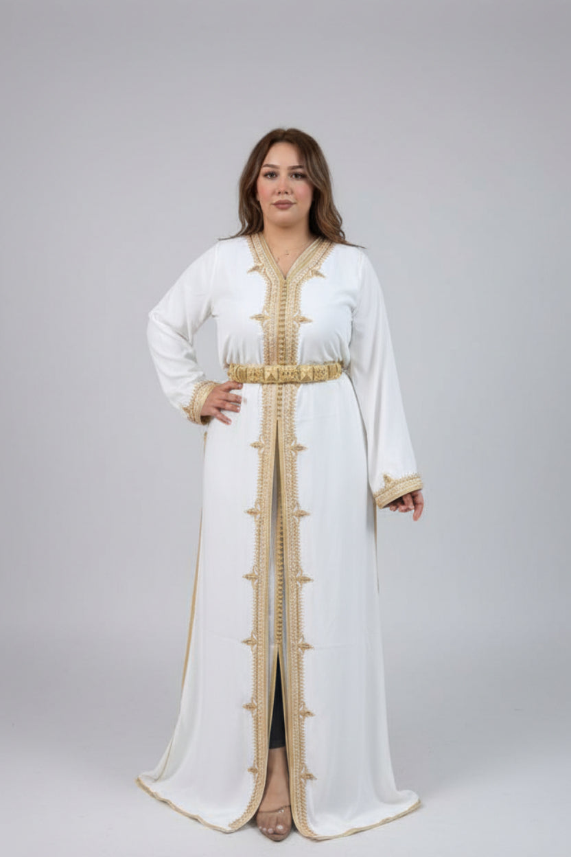 Woman in a white and gold Kaftan standing in a clothing store with colorful garments on racks.
"caftan dress"
"women's caftan"
"kaftan"
"cotton caftan"
"caftan moroccan"
"moroccan caftan"
"men's caftan"
"caftan for women"
"white caftan"
"blue caftan"
"what is caftan"
"caftan dresses"
"caftan men"
"silk caftan"
"vintage caftan"
"maxi dress"
"beach caftan"
"caftan maxi dress"
"caftan for men"
"what is a caftan"
"caftan cover up"
"kaftan dress"
"plus size caftan"
"caftan plus size"
"short caftan"