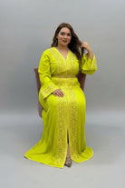 Woman wearing a bright yellow dress with intricate patterns on a plain background 
"kaftan dress""
"kaftan dresses"
"women kaftan"
"kaftan women"
"black kaftan"
"kaftan for women"
"men's kaftan"
"maxi kaftan"
"kaftan set"
"long kaftan"
"white kaftan"
"kaftan maxi dress"
"cotton kaftan"
"silk kaftan"
"blue kaftan"
"kaftan men"
"men kaftan"
"what is kaftan"
"caftan"
"moroccan kaftan"
"kaftan moroccan"
"kaftan top"
"embroidered kaftan"
"black kaftan dress"
"long kaftan dress"
"linen kaftan"
"abaya"