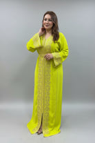 Woman wearing a bright yellow dress with intricate patterns in a clothing store.
"kaftan dress""
"kaftan dresses"
"women kaftan"
"kaftan women"
"black kaftan"
"kaftan for women"
"men's kaftan"
"maxi kaftan"
"kaftan set"
"long kaftan"
"white kaftan"
"kaftan maxi dress"
"cotton kaftan"
"silk kaftan"
"blue kaftan"
"kaftan men"
"men kaftan"
"what is kaftan"
"caftan"
"moroccan kaftan"
"kaftan moroccan"
"kaftan top"
"embroidered kaftan"
"black kaftan dress"
"long kaftan dress"
"linen kaftan"
"abaya"