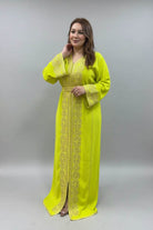 Woman wearing a bright yellow dress with intricate patterns in a clothing store.
"kaftan dress""
"kaftan dresses"
"women kaftan"
"kaftan women"
"black kaftan"
"kaftan for women"
"men's kaftan"
"maxi kaftan"
"kaftan set"
"long kaftan"
"white kaftan"
"kaftan maxi dress"
"cotton kaftan"
"silk kaftan"
"blue kaftan"
"kaftan men"
"men kaftan"
"what is kaftan"
"caftan"
"moroccan kaftan"
"kaftan moroccan"
"kaftan top"
"embroidered kaftan"
"black kaftan dress"
"long kaftan dress"
"linen kaftan"
"abaya"