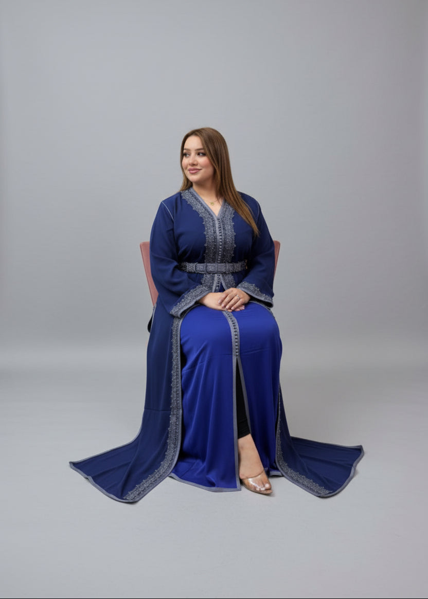 Two women in blue dresses with silver accents sitting in a store.
"caftan dress"
"women's caftan"
"kaftan"
"cotton caftan"