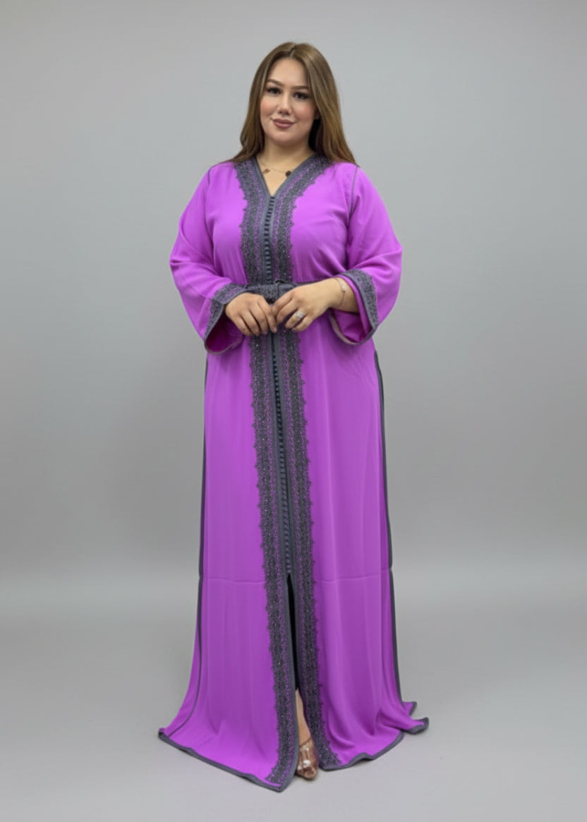 Woman wearing a purple dress with a black border in a fabric store.
"caftan dress"
"women's caftan"
"kaftan"
"cotton caftan"
"caftan moroccan"
