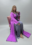 Woman trying on a purple and gray dress in a store 
"caftan dress"
"women's caftan"
"kaftan"
"cotton caftan"
"caftan moroccan"
"moroccan caftan"
"men's caftan"
"caftan for women"
"white caftan"
"blue caftan"
"what is caftan"
"caftan dresses"
"caftan men"
"silk caftan"
"vintage caftan"
"maxi dress"
"beach caftan"
"caftan maxi dress"
"caftan for men"
"what is a caftan"
"caftan cover up"
"kaftan dress"
"plus size caftan"
"caftan plus size"
"short caftan"
"linen caftan"
"womens caftan"
"caftan meaning"

