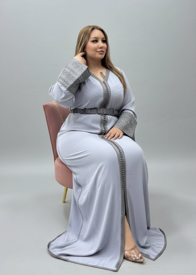 Woman wearing a long, light gray dress with a belt and matching cardigan on a plain background
"kaftan dress""
"kaftan dresses"
"women kaftan"
"kaftan women"
"black kaftan"
"kaftan for women"
"men's kaftan"
"maxi kaftan"
"kaftan set"
"long kaftan"
"white kaftan"
"kaftan maxi dress"
"cotton kaftan"
"silk kaftan"
"blue kaftan"
"kaftan men"
"men kaftan"
"what is kaftan"
"caftan"
"moroccan kaftan"
"kaftan moroccan"
"kaftan top"
"embroidered kaftan"
"black kaftan dress"
"long kaftan dress"
"linen kaftan"
"abaya"