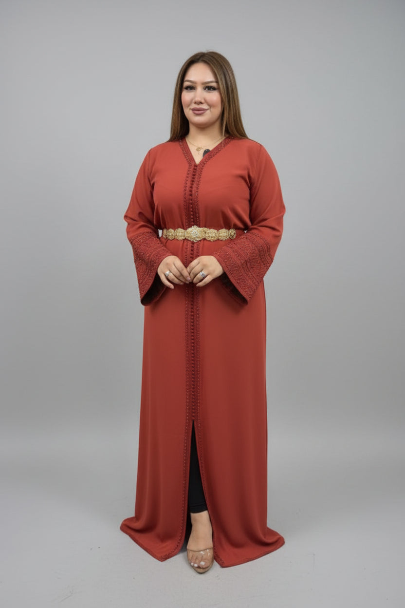 Woman wearing a long rust-colored dress with a belt on a gray background "kaftan dress""
"kaftan dresses"
"women kaftan"
"kaftan women"
"black kaftan"
"kaftan for women"
"men's kaftan"
"maxi kaftan"
"kaftan set"
"long kaftan"
"white kaftan"
"kaftan maxi dress"
"cotton kaftan"
"silk kaftan"
"blue kaftan"
"kaftan men"
"men kaftan"
"what is kaftan"
"caftan"
"moroccan kaftan"
"kaftan moroccan"
"kaftan top"
"embroidered kaftan"
"black kaftan dress"
"long kaftan dress"
"linen kaftan"
"abaya"
