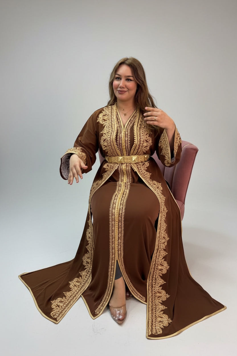 Woman wearing a brown and gold embroidered outfit in a store setting.
"caftan dress"
"women's caftan"
"kaftan"
"cotton caftan"
"caftan moroccan"
"moroccan caftan"
"men's caftan"
"caftan for women"
"white caftan"
"blue caftan"
"what is caftan"
"caftan dresses"
"silk caftan"
"vintage caftan"
"maxi dress"
"beach caftan"
"caftan maxi dress"
"caftan for men"
"what is a caftan"
"caftan cover up"
"kaftan dress"
"plus size caftan"
"caftan plus size"
"short caftan"
"linen caftan"
"womens caftan"
"caftan meaning"
