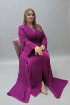 Woman wearing a purple dress with intricate detailing in a fabric store.
"caftan dress"
"women's caftan"
"kaftan"
"cotton caftan"
"caftan moroccan"
"moroccan caftan"
"men's caftan"
"caftan for women"
"white caftan"
"blue caftan"
"what is caftan"
"caftan dresses"
"caftan men"
"silk caftan"
"vintage caftan"
"maxi dress"
"beach caftan"
"caftan maxi dress"
"caftan for men"
"what is a caftan"
"caftan cover up"
"kaftan dress"
"plus size caftan"
"caftan plus size"
"short caftan"
"linen caftan"
"womens caftan"
