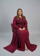 Woman trying on a red dress in a store with fabric displayed on shelves."kaftan dress""
"kaftan dresses"
"women kaftan"
"kaftan women"
"black kaftan"
"kaftan for women"
"men's kaftan"
"maxi kaftan"
"kaftan set"
"long kaftan"
"white kaftan"
"kaftan maxi dress"
"cotton kaftan"
"silk kaftan"
"blue kaftan"
"kaftan men"
"men kaftan"
"what is kaftan"
"caftan"
"moroccan kaftan"
"kaftan moroccan"
"kaftan top"
"embroidered kaftan"
"black kaftan dress"
"long kaftan dress"
"linen kaftan"
"abaya",11,"20%"
"kaftan abaya