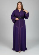 Woman wearing a purple dress with intricate designs on a gray background "kaftan dress""
"kaftan dresses"
"women kaftan"
"kaftan women"
"black kaftan"
"kaftan for women"
"men's kaftan"
"maxi kaftan"
"kaftan set"
"long kaftan"
"white kaftan"
"kaftan maxi dress"
"cotton kaftan"
"silk kaftan"
"blue kaftan"
"kaftan men"
"men kaftan"
"what is kaftan"
"caftan"
"moroccan kaftan"
"kaftan moroccan"
"kaftan top"
"embroidered kaftan"
"black kaftan dress"
"long kaftan dress"
"linen kaftan"
"abaya"
"kaftan abay