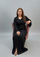 Woman in a black outfit sitting in a store with fabric shelves in the 
background
"kaftan dress""
"kaftan dresses"
"women kaftan"
"kaftan women"
"black kaftan"
"kaftan for women"
"men's kaftan"
"maxi kaftan"
"kaftan set"
"long kaftan"
"white kaftan"
"kaftan maxi dress"
"cotton kaftan"
"silk kaftan"
"blue kaftan"
"kaftan men"
"men kaftan"
"what is kaftan"
"caftan"
"moroccan kaftan"
"kaftan moroccan"
"kaftan top"
"embroidered kaftan"
"black kaftan dress"
"long kaftan dress"
"linen kaftan"
"abaya"