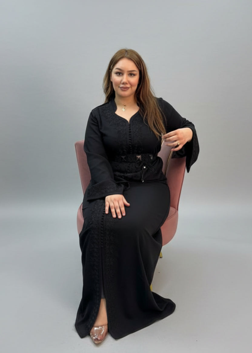 Woman in a black outfit sitting in a store with fabric shelves in the 
background
"kaftan dress""
"kaftan dresses"
"women kaftan"
"kaftan women"
"black kaftan"
"kaftan for women"
"men's kaftan"
"maxi kaftan"
"kaftan set"
"long kaftan"
"white kaftan"
"kaftan maxi dress"
"cotton kaftan"
"silk kaftan"
"blue kaftan"
"kaftan men"
"men kaftan"
"what is kaftan"
"caftan"
"moroccan kaftan"
"kaftan moroccan"
"kaftan top"
"embroidered kaftan"
"black kaftan dress"
"long kaftan dress"
"linen kaftan"
"abaya"