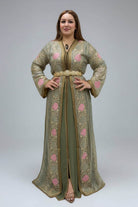 Woman wearing a green embroidered dress in a clothing store.
"caftan dress"
"women's caftan"
"kaftan"
"cotton caftan"
"caftan moroccan"
"moroccan caftan"
"men's caftan"
"caftan for women"
"white caftan"
"blue caftan"
"what is caftan"
"caftan dresses"
"caftan men"
"silk caftan"
"vintage caftan"
"maxi dress"
"beach caftan"
"caftan maxi dress"
"caftan for men"
"what is a caftan"
"caftan cover up"
"kaftan dress"
"plus size caftan"
"caftan plus size"
"short caftan"
"linen caftan"
"womens caftan"
"caftan meaning"